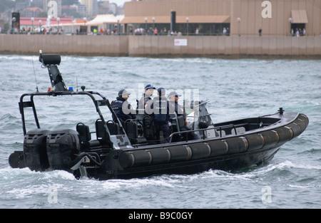 Police RHIB (Rigid Hull Inflatable Boat) provides security during a special event on Sydney Harbour. Stock Photo