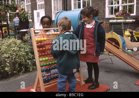 Nursery school children in the school playground. Stock Photo