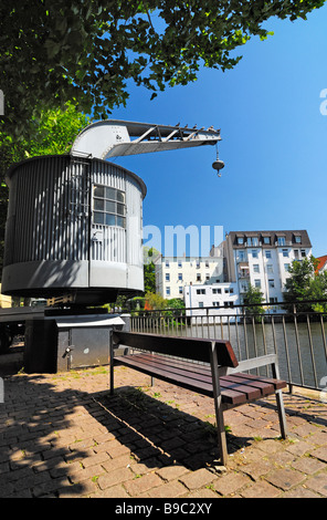 Historic crane at the waterside of the Serrahn in Bergedorf, Hamburg. Stock Photo