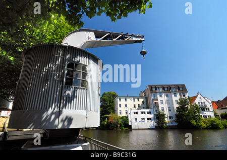 Historic crane at the waterside of the Serrahn in Bergedorf, Hamburg. Stock Photo