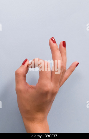 Close up of a woman's hand with a ok gesture Stock Photo