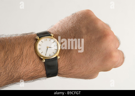 Close up of a man wearing a wristwatch Stock Photo