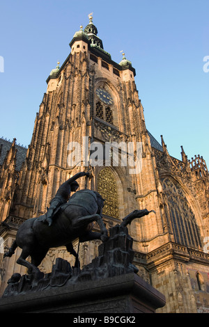 View of St.Vitus cathedral main tower with equestrian monument of St George in courtyard of Prague castle, Czech republic. Stock Photo