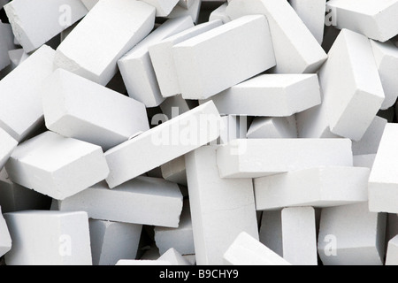 Heap of new white bricks close-up. Stock Photo