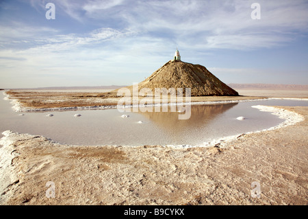 Mound of salt on salt lake in winter at Chott el-Jerid, Tunisia under dramatic sky Stock Photo