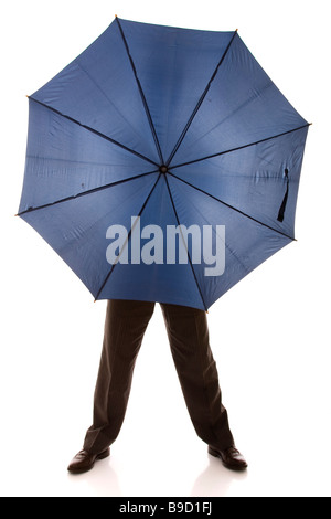 businessman hiding behind a blue umbrella isolated on white Stock Photo