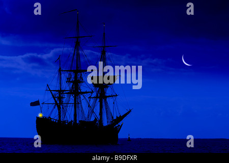 awesome,amazing,big,biggest,colossal,moon,rise,Barque,gaffer,Replica of, James Cook,gaffer,Cook's ship, Endeavour, Solent Isle of Wight England  huge Stock Photo
