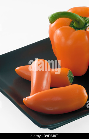 Orange Bellpepper and orange Mini peppers Stock Photo