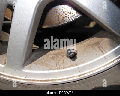 Alloy wheel brake disc and tyre valve Stock Photo