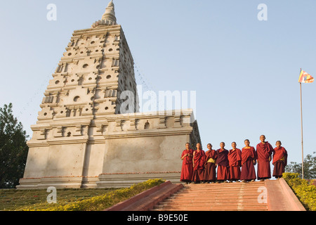 Monks standing at a temple, Mahabodhi Temple, Bodhgaya, Gaya, Bihar, India Stock Photo