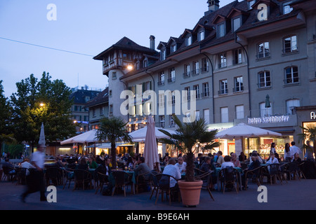 Guests sitting in pavement cafes at Bärenplatz in the evening Old Town Berne Canton of Berne Switzerland Stock Photo