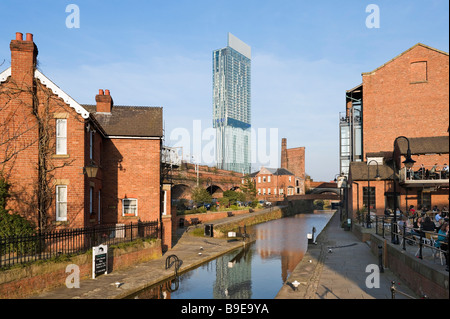 Redeveloped canalside area of Castlefield in the early evening with the Beameth Tower in the distance, Manchester, England Stock Photo