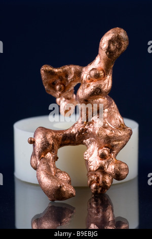 Copper (Cu) is one of the few metallic elements that is found in elemental form. Stock Photo