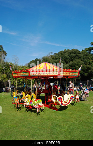 a vintage merry go round at a country fair in cornwall,uk Stock Photo