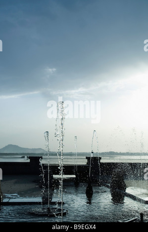 Fountains in a garden, Nishat Garden, Dal Lake, Srinagar, Jammu And Kashmir, India Stock Photo