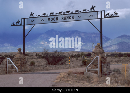 Wrought iron ranch gate near Buckhorn in Grant County Mogollon Mtns in distance New Mexico USA Stock Photo