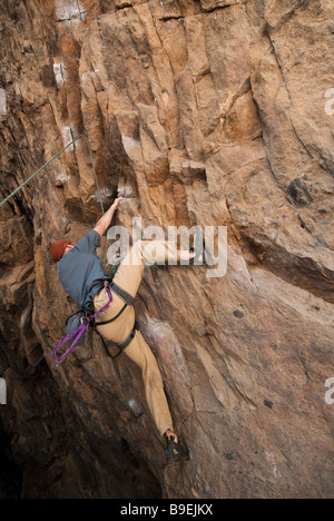 Climber practices in a shallow cave, Eldorado Canyon State Park, Eldorado Springs, Colorado. Stock Photo