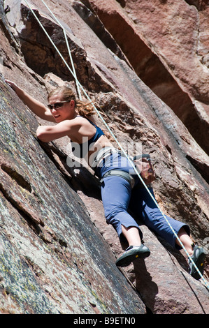 Female climber on the cliffs, Eldorado Canyon State Park, Eldorado Springs, Colorado. Stock Photo