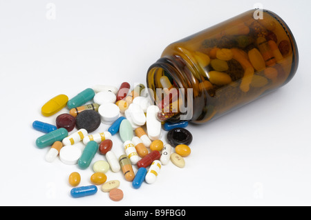 Colorful tablets with a small bottle studio picture