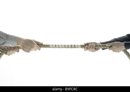 Close-up of two men pulling rope Stock Photo