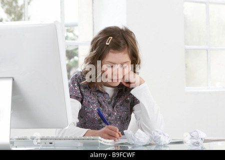 Close-up of girl studying at table Stock Photo