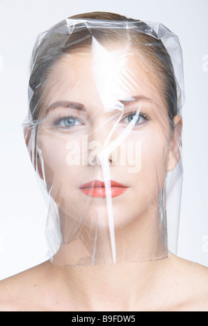 woman wrapped in foil, portrait Stock Photo