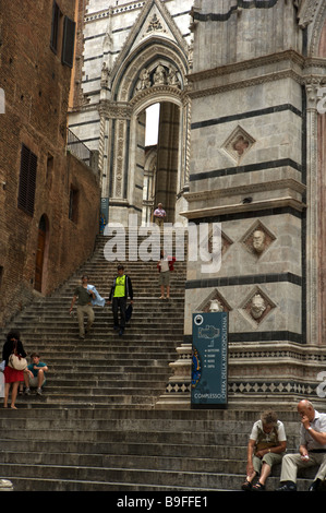 Tourists at the Duomo church in Italy Stock Photo