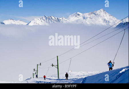 Skiing Above the Mist, Swiss Alps Stock Photo