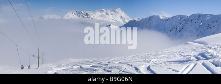 Skiing Above the Mist, Swiss Alps Stock Photo