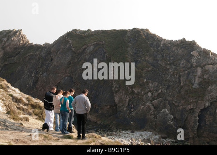 People viewing Stair hole at Lulworth Cove part of the Jurassic Coast Stock Photo