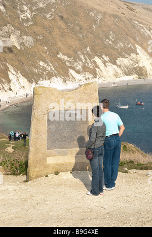 Viewing World Heritage commerative stone at Lulworth Cove Stock Photo