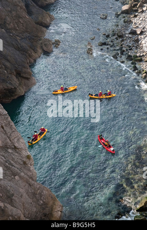 Canoes in the Stair Hole next to Lulworth Cove Dorset Stock Photo