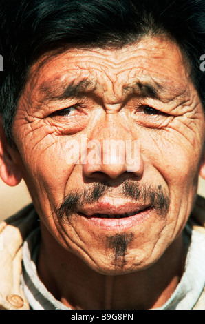 tibetan old man portrait head and shoulders Stock Photo