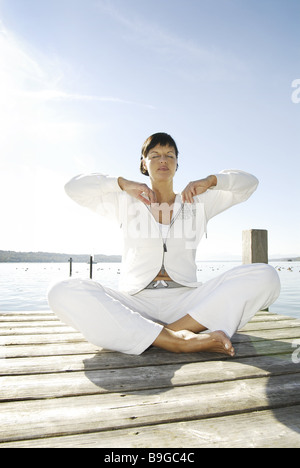 30-40 years alone balance outside barefoot brunette deeply-breathing relaxation recuperation woman leisure time leisurewear Stock Photo