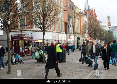 People walking in market street Manchester city centre UK Stock Photo