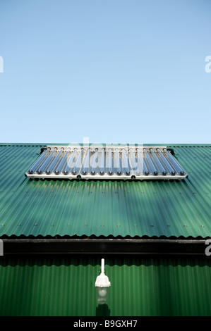 Solar Heating array of tubes on a roof converting sunlight into energy to heat water, UK Stock Photo