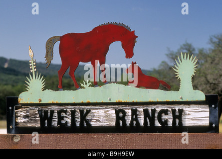 Wrought iron ranch sign at gate near Presidio, Texas, USA with Sierra ...