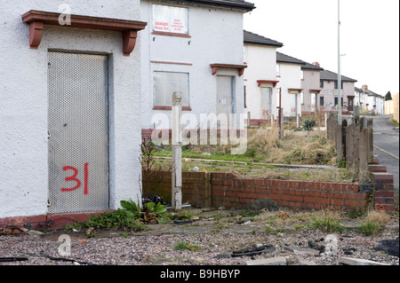 A row of empty derelict houses on a derelict housing estate near Wolverhampton in the Black Country in the West Midlands Stock Photo