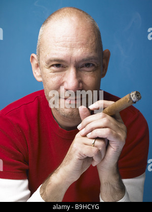 Man bald head cigar smokes smiling portrait series people designer stubble cigar-smokers smokers pleasing-products tobaccos Stock Photo