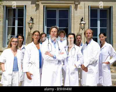 Doctors standing outdoors Stock Photo