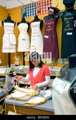 Girls in an apron shop in Venice Italy Stock Photo