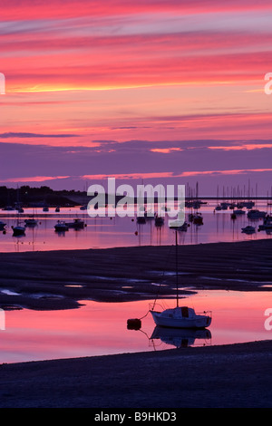 A colourful dusk over the sailing boats moored in Conwy Bay viewed from Conwy Bridge, North Wales, United Kingdom Stock Photo