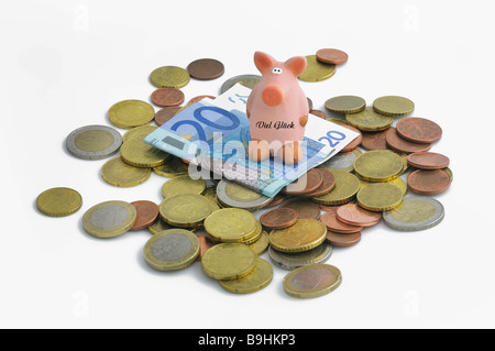 Lucky pig on euro coins and 20 euro bill Stock Photo