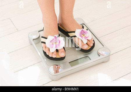Feet on scales Stock Photo