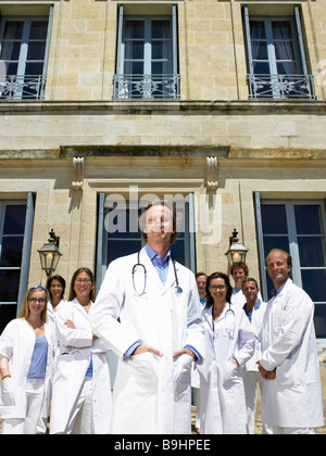 Doctors standing outdoors Stock Photo