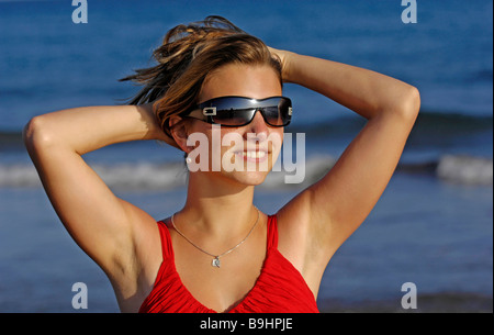 Young woman wearing sunglasses Stock Photo