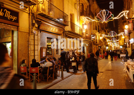 Busy street scene in El Carmen during Las Fallas festival historical city centre of Valencia Spain Stock Photo