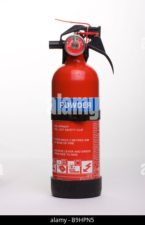 Small red Dry Powder fire extinguisher cut out against white background Stock Photo