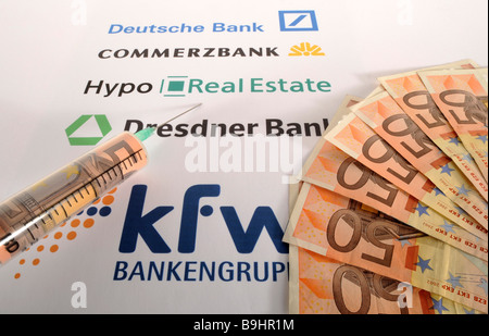 Injection needle of logos of different banks, and 50 euro banknotes, symbolic picture for cash injection, economy boost Stock Photo