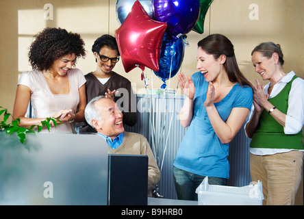 Group of office workers celebrating